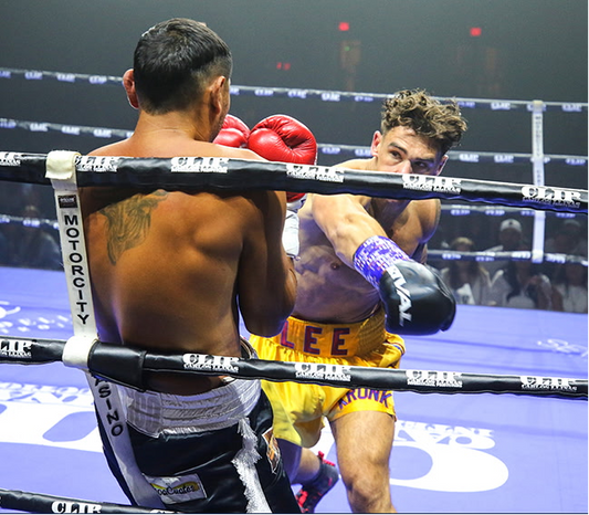 Hunter Lee throws a right hand in KRONK gold trunks at Motor City Casino.